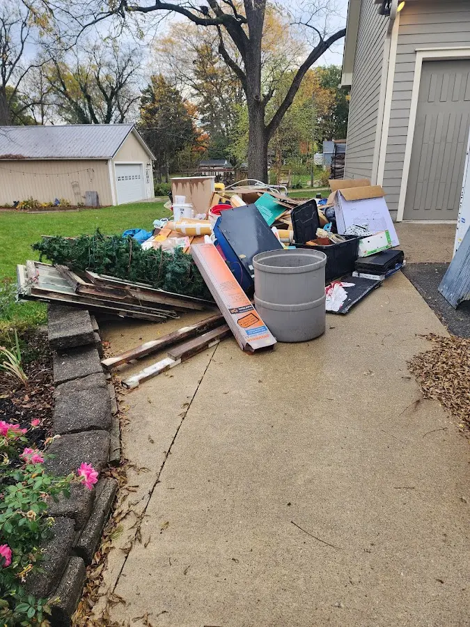 Dumpster being loaded with debris for 30 Yard Dumpster Rental in Indian Trail